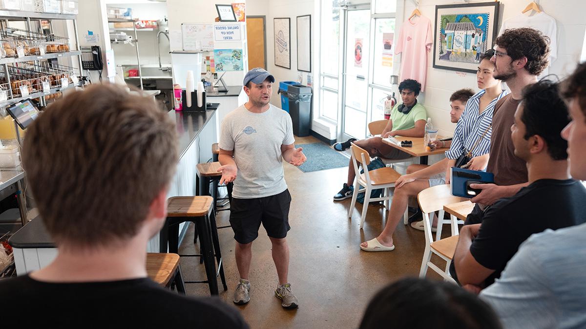 Alex Brandwein, owner of Brandwein's Bagels, speaks to student entrepreneurs as part of the LAUNCH summer accelerator.