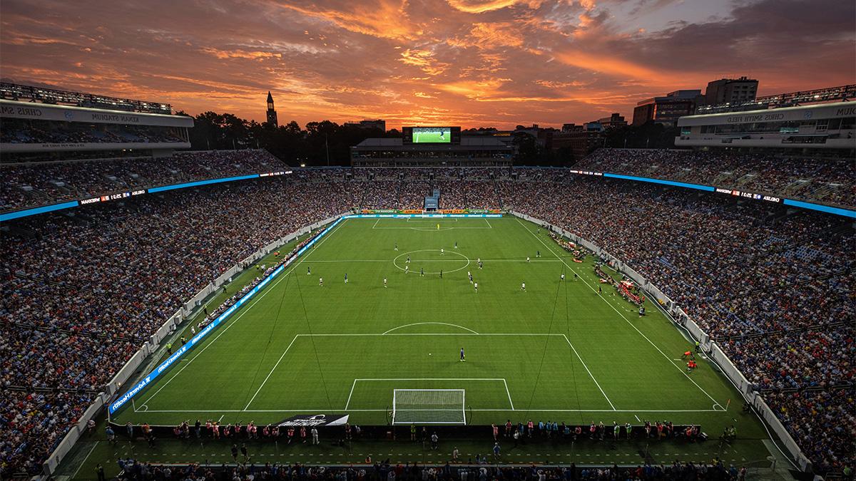 Kenan Stadium at sunset hosting an international soccer match.